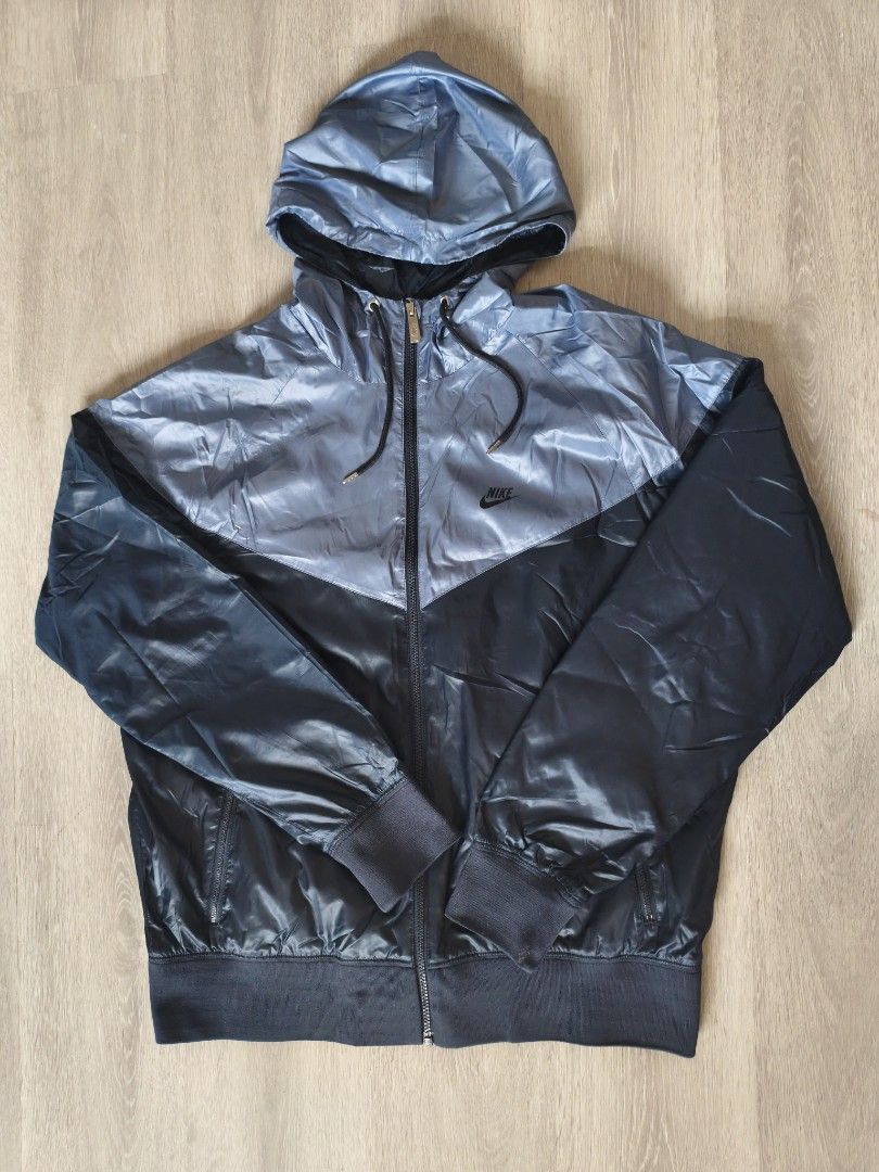 Nike Two-Tone Windbreaker Jacket (Category: Coats, Jackets and Outerwear) located in Manila. Submitted by ekko08 (Listing ID 1469526592, Image 1). Description: - Authentic Nike hooded windbreaker jacket - Eye-catching two-tone metallic blue and dark blue design - Lightweight and durable nylon material - Full zip closure with adjustable drawstring hood - Secure side zip pockets for your essentials - Ribbed cuffs and hem for a comfortable fit - Cla