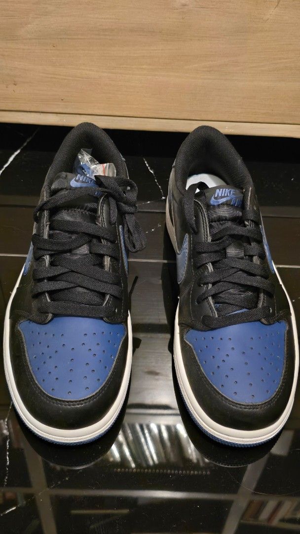 Nike US 8.5 men (Category: Sneakers) located in Quezon City. Submitted by ShoesManila (Listing ID 1469538477, Image 2). Description: Nike size 8.5 men - Brand: Nike Air Jordan 1 Low - Colorway: Black / Royal Blue / White - Material: Classic leather upper with perforated toe box - Details: Signature Swoosh branding, embossed winged basketball logo on heel - Soles: White midsole with durable blue rubber outsole - Inclusions: Extra set of blue and b