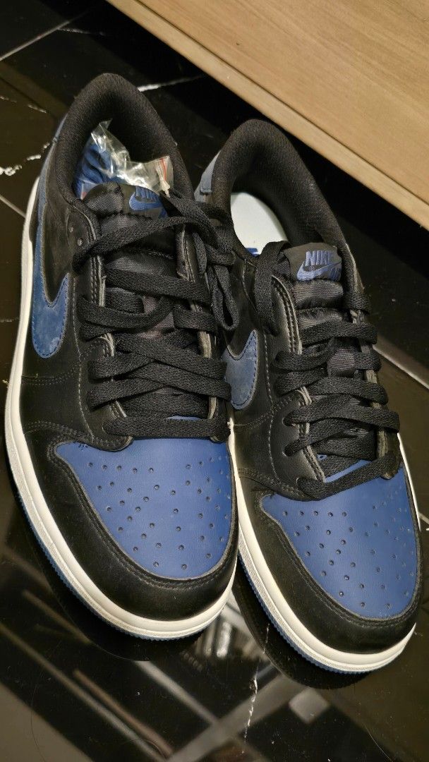 Nike US 8.5 men (Category: Sneakers) located in Quezon City. Submitted by ShoesManila (Listing ID 1469538477, Image 3). Description: Nike size 8.5 men - Brand: Nike Air Jordan 1 Low - Colorway: Black / Royal Blue / White - Material: Classic leather upper with perforated toe box - Details: Signature Swoosh branding, embossed winged basketball logo on heel - Soles: White midsole with durable blue rubber outsole - Inclusions: Extra set of blue and b