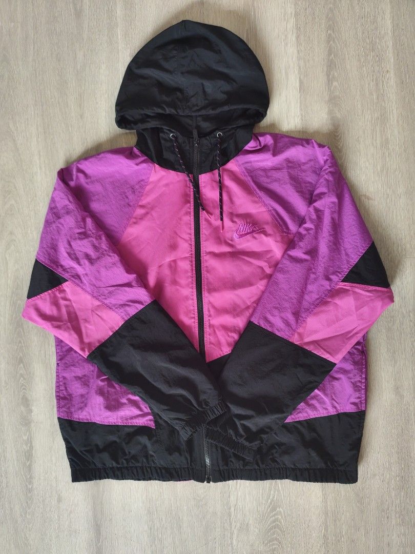 Nike Windbreaker Jacket Pink Black Hooded (Category: Coats, Jackets and Outerwear) located in Manila. Submitted by ekko08 (Listing ID 1469526206, Image 1). Description: - Brand: Nike - Design: Stylish pink, magenta, and black color block - Features: Full zip closure, adjustable drawstring hood, and embroidered chest logo - Fit: Lightweight with elastic cuffs and hem - Ideal for: Breezy weather, workouts, and layering.