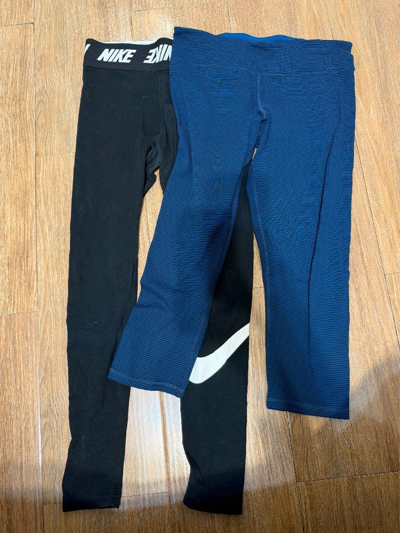 Nike Women Leggings Bundle (Category: Activewear) located in Manila. Submitted by garagesalebykoda (Listing ID 1469514784, Image 1). Description: - Bundle of 3 pairs of Nike women's leggings - Includes 2 black pairs and 1 blue striped pair - Black pair 1 features Nike logo text on the elastic waistband - Black pair 2 features a large white swoosh logo near the calf - Comfortable stretch material ideal for workouts or casual wear - Excellent value
