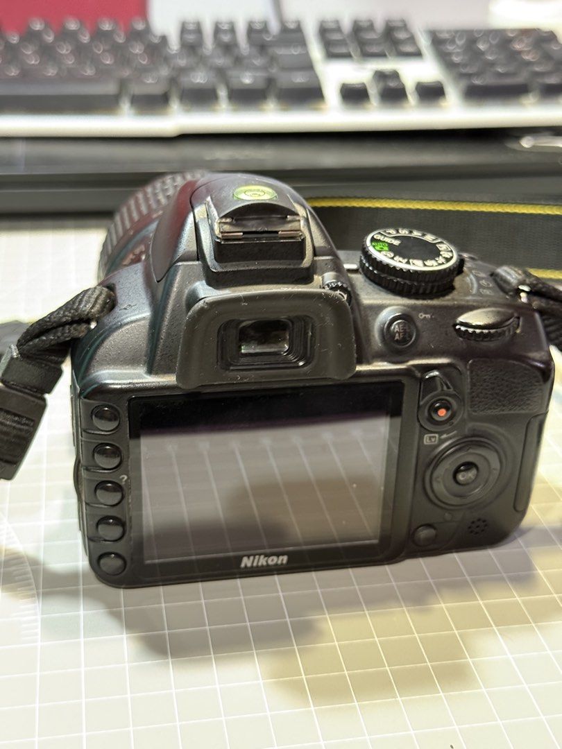 Nikon D3100 DSLR Camera with Kitlens (Category: Cameras) located in Mandaluyong City. Submitted by benjperez (Listing ID 1469517293, Image 2). Description: Nikon D3100 DSLR with 18-55mm Kitlens Condition: (First Owner) Signs of Usage sa body and lens Intact Rubber Covers Crispy Buttons and Dials Has fungus sa kitlens (bili na lang kayo bago or palinis) Has Vignette in LCD pero tolerable (see pics) Short Specs: - Sensor: 14.2 effective megapixels,