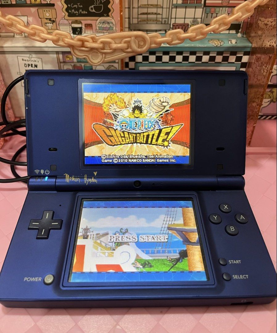 Nintendo DSi - Metallic Blue (Category: Nintendo) located in Valenzuela. Submitted by moshiiri_kawaii_v2 (Listing ID 1469549733, Image 3). Description: Nintendo DSi - Metallic Blue Working touch screen, buttons and dual cameras, Seems not yet repaired - Intact sticker warranty With 25 games installed Goods battery life Inclusion : Unit, R4 with 2gb microsd, orig stylus, replacement power cord (adaptor not included) Flaws: minimal scratches, Scree