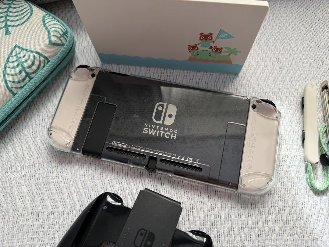 Nintendo Switch Animal Crossing Edition (Category: Nintendo) located in Manila. Submitted by anne.angel (Listing ID 1469426224, Image 2). Description: Selling Nintendo Switch Animal Crossing Limited Edition. Comes with special dock, Joy-Cons with paw grips, matching carry case, straps, grip, and clear protective case. Complete bundle ready to play! Negotiable but please be reasonable In a very good condition .