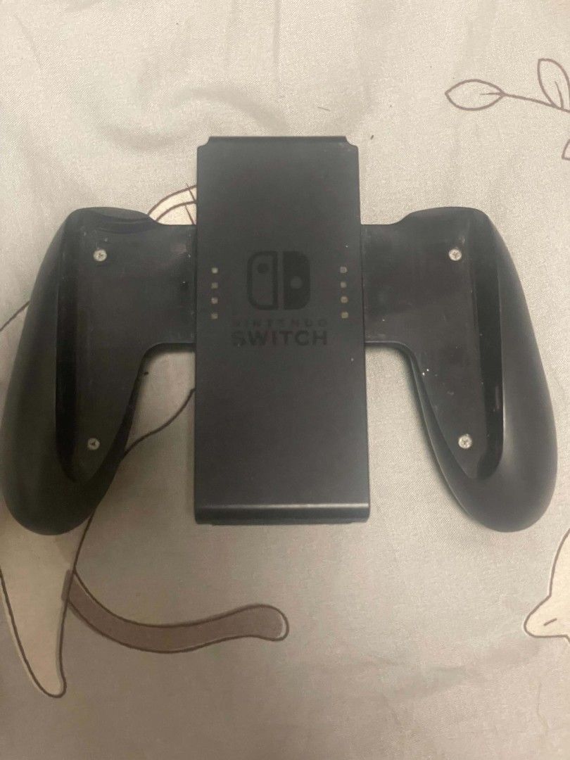 Nintendo Switch Joy-Con Grip (Category: Controllers) located in Caloocan City. Submitted by EUMMC (Listing ID 1469514281, Image 1). Description: Signs of use only.