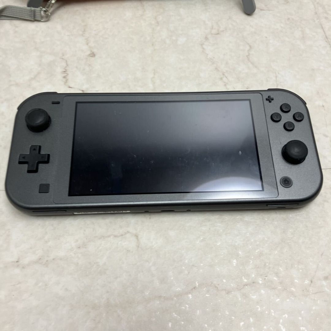 Nintendo Switch Lite (Gray) with dedicated case – Junk/Defective (Category: PlayStation) located in Caloocan City. Submitted by letao_shopping_ph (Listing ID 1469490248, Image 2). Description: Used item Included accessories: Everything shown in the photos Year/Model: Please refer to the photos Size: Please refer to the photos Condition This item is sold as-is (for parts/repair). Please use it for parts or similar purposes. There may be scratches,