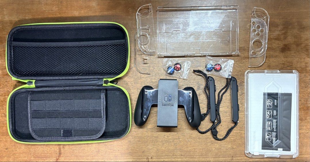 Nintendo Switch (OLED version) (Category: Nintendo) located in Singapore. Submitted by blbz. (Listing ID 1469497018, Image 3). Description: ‼️ABLE TO NEGO‼️ Brought in Mar 2026, so warranty is still VALID. Receipt still present. Able to meet up at buyer’s POC upon a small top up. Comes with: - HDMI and charging cable - Dock (with Mario theme accessories which also can keep game cartridges - see pic 1) - Controller holder - Free screen protector (