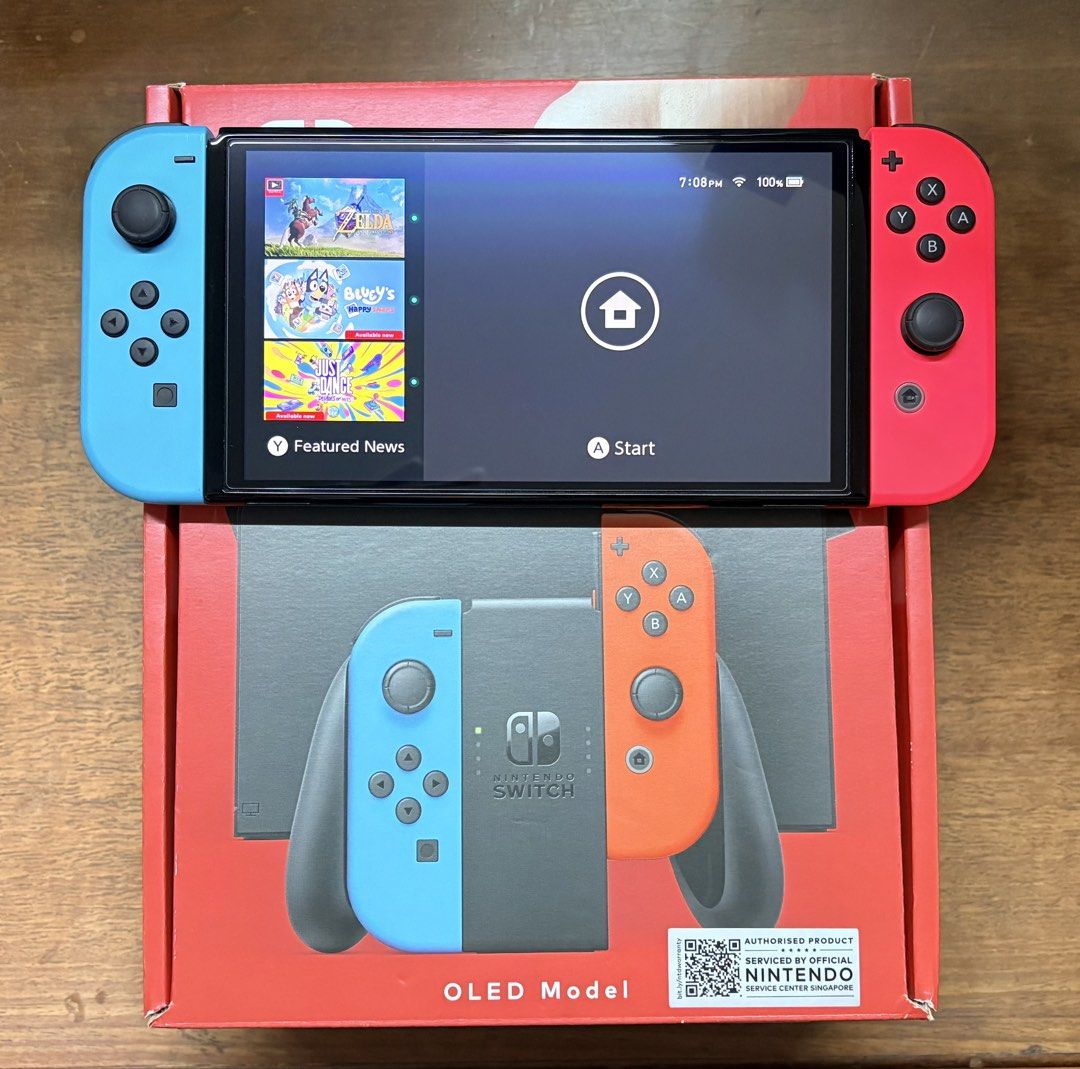 Nintendo Switch (OLED version) (Category: Nintendo) located in Singapore. Submitted by blbz. (Listing ID 1469497018, Image 2). Description: ‼️ABLE TO NEGO‼️ Brought in Mar 2026, so warranty is still VALID. Receipt still present. Able to meet up at buyer’s POC upon a small top up. Comes with: - HDMI and charging cable - Dock (with Mario theme accessories which also can keep game cartridges - see pic 1) - Controller holder - Free screen protector (