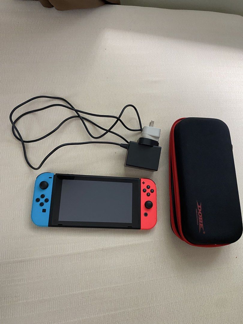 Nintendo Switch V1 (Category: Nintendo) located in Quezon City. Submitted by jbruhhh (Listing ID 1469519028, Image 1). Description: Selling my spare Nintendo Switch -No issues on joycons and system -Not jailbreak -32gb Includes: Orig charger Dobe case 📍Katip area.