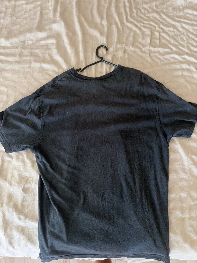 Nirvana Smiley Face Graphic Band T-Shirt (Category: Tshirts & Polo Shirts ) located in Manila. Submitted by the_ghost_of_the_uchiha (Listing ID 1469460227, Image 2). Description: - Authentic vintage look: Faded black Nirvana band t-shirt with a soft, worn-in feel - Eye-catching graphic: Large yellow smiley face cascade print on the front, plain solid black back - Comfortable fit: Classic crew neck, short sleeves, and a relaxed oversized silhouett