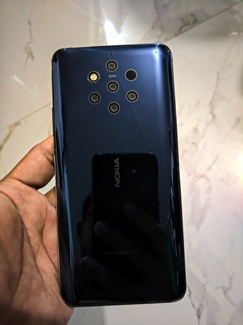 Nokia 9 Pureview (Category: Android Others) located in General Trias. Submitted by mervcorner (Listing ID 1469558960, Image 2). Description: Nokia 9 PureView (Midnight Blue) Model: TA-1087 6GB | 128GB Dual Sim Original. No history of repair. Not refurbished. Openline to all networks. Unit with Case and Lanyard only. Issue: Battery (need replacement) Battery has been replaced 2x eversince I bought this unit considering its age. Walang glue ang bac