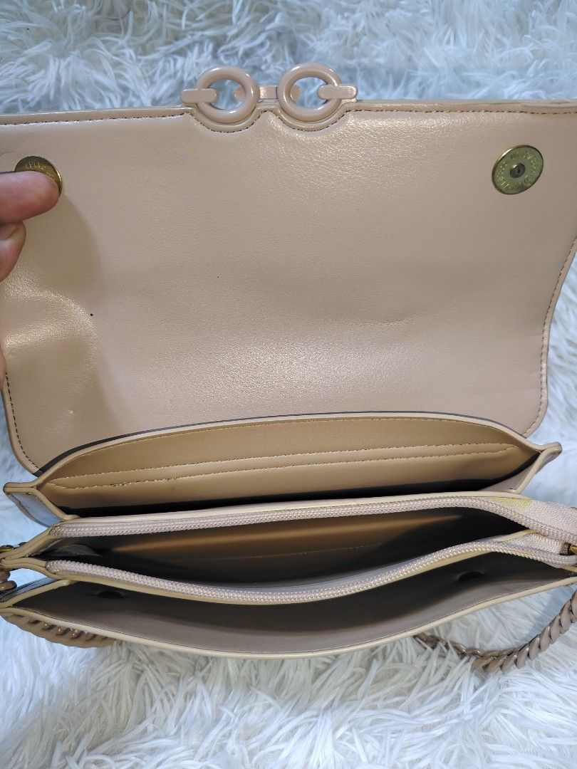 Nude Crossbody Handbag (Category: Cross-body Bags) located in Quezon City. Submitted by zhelcloset01 (Listing ID 1469505434, Image 3). Description: - Style: Charles & Keith inspired nude handbag - Closure: Secure magnetic flap - Details: Trendy decorative chain link accent on the front - Straps: Includes both a short chain handle and a separate adjustable shoulder strap - Interior: Multiple compartments with built-in zipper pockets and clean lini