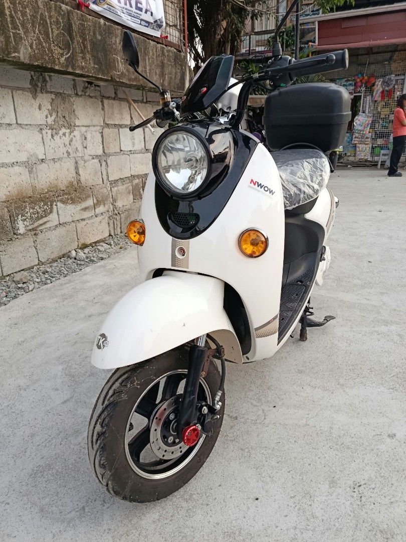 NWOW TK10 Electric Scooter White (Category: Skates, Rollerblades & Scooters) located in Manila. Submitted by dianne_teves (Listing ID 1469506588, Image 3). Description: 📌FOR SALE!!!!!! 🛵NWOW TK10 Di na nagagamit look as new pa. 𝐁𝐚𝐭𝐭𝐞𝐫𝐲: 𝟔𝟎𝐕 𝟐𝟎𝐀𝐇 𝐌𝐚𝐱. 𝐒𝐩𝐞𝐞𝐝: 𝟒𝟓-𝟓𝟎𝐤𝐦/𝐡 𝐌𝐢𝐥𝐞𝐚𝐠𝐞 𝐑𝐚𝐧𝐠𝐞: 𝟖𝟓𝟒𝐤𝐦 𝐌𝐚𝐱. 𝐋𝐨𝐚𝐝: 𝟏𝟖𝟎𝐤𝐠 𝗖𝗵𝗮𝗿𝗴𝗶𝗻𝗴 𝘁𝗶𝗺𝗲: 6 to 8 hours ✅Papers with two (2) keys. ✅Lights, breaks, 