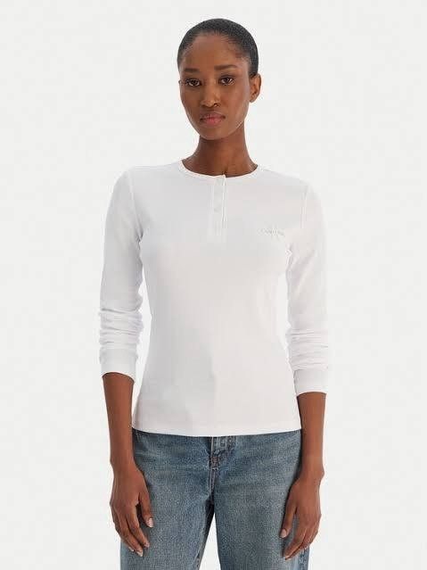 (NWT) Calvin Klein Long-Sleeve Henley Top (Category: Longsleeves) located in Gapan. Submitted by lovelypreloved1497 (Listing ID 1469428190, Image 1). Description: ✨ Brand New with Tags (NWT) Calvin Klein Long-Sleeve Henley Top ✨ Letting go of this crisp, classic women's long-sleeve knit Henley top from Calvin Klein. Features a timeless white colorway, a 4-button neckline placket, and the signature "CK" monogram emblem embroidered beautifully on t