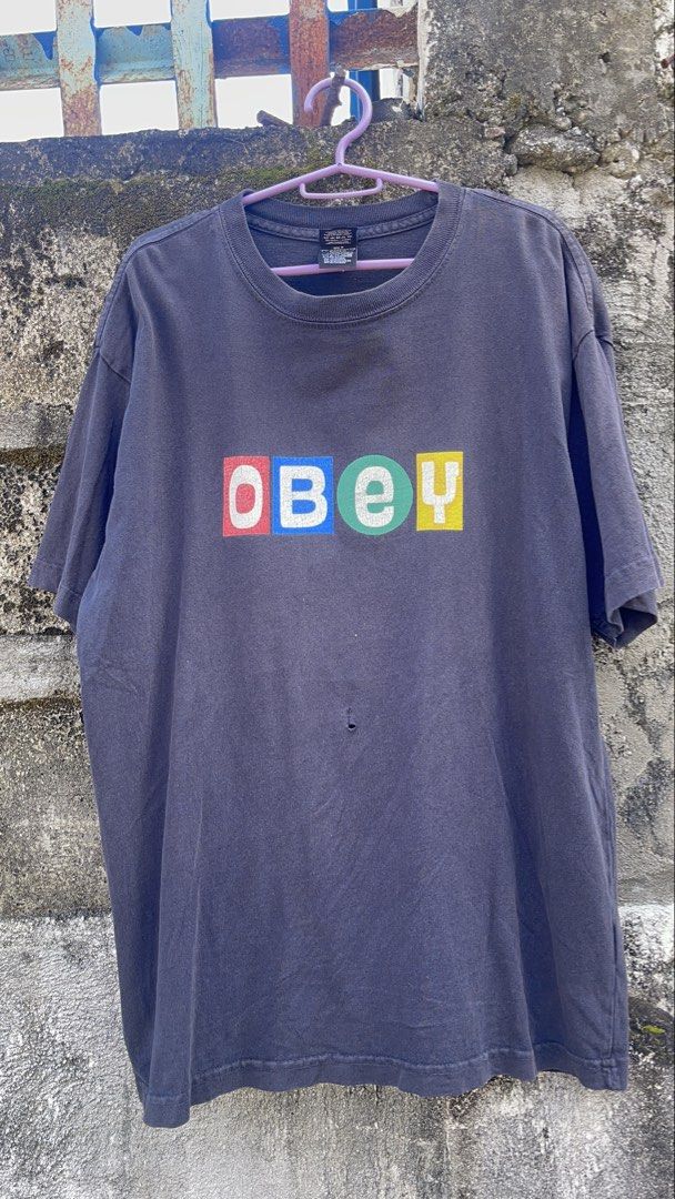 Obey Graphic T-Shirt Size S (Category: Tshirts & Polo Shirts ) located in Balanga. Submitted by death_vintage (Listing ID 1469476622, Image 1). Description: - Brand: Obey - Color: Faded black with multi-color chest logo - Size: S (Regular fit) - Origin: Made in Mexico - Details: Ribbed crew neck.