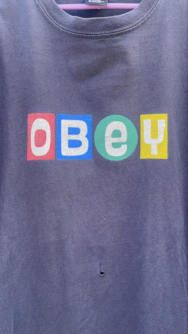 Obey Graphic T-Shirt Size S (Category: Tshirts & Polo Shirts ) located in Balanga. Submitted by death_vintage (Listing ID 1469476622, Image 2). Description: - Brand: Obey - Color: Faded black with multi-color chest logo - Size: S (Regular fit) - Origin: Made in Mexico - Details: Ribbed crew neck.