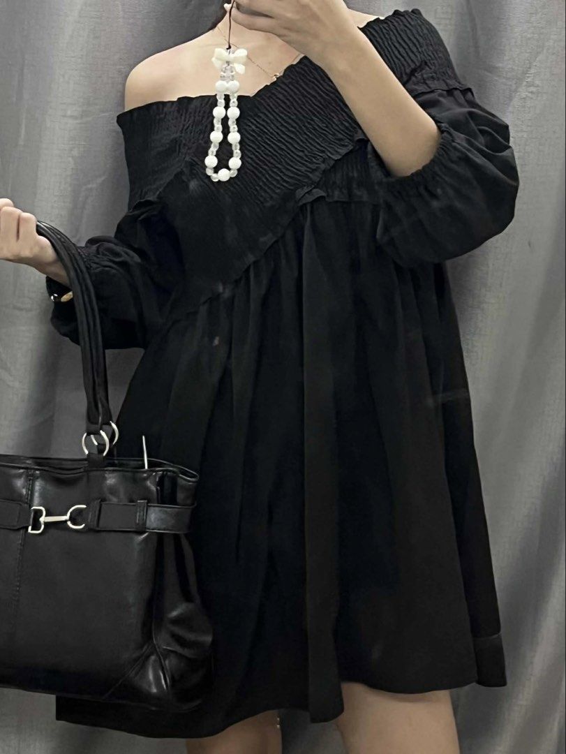 Two-Way Asymmetric Off-Shoulder Mini Dress (Category: Dresses) located in General Mariano Alvarez. Submitted by kascade (Listing ID 1469510094, Image 1). Description: - Color: Black - Style: Two-way styling — can be worn as an off-shoulder dress and styled asymmetrically - Details: Asymmetric pleated chest overlay - Fit: Smocked stretchy bodice and flowy flared skirt hitting above the knee - Sleeves: Long balloon sleeves with elastic cuffs - Cond