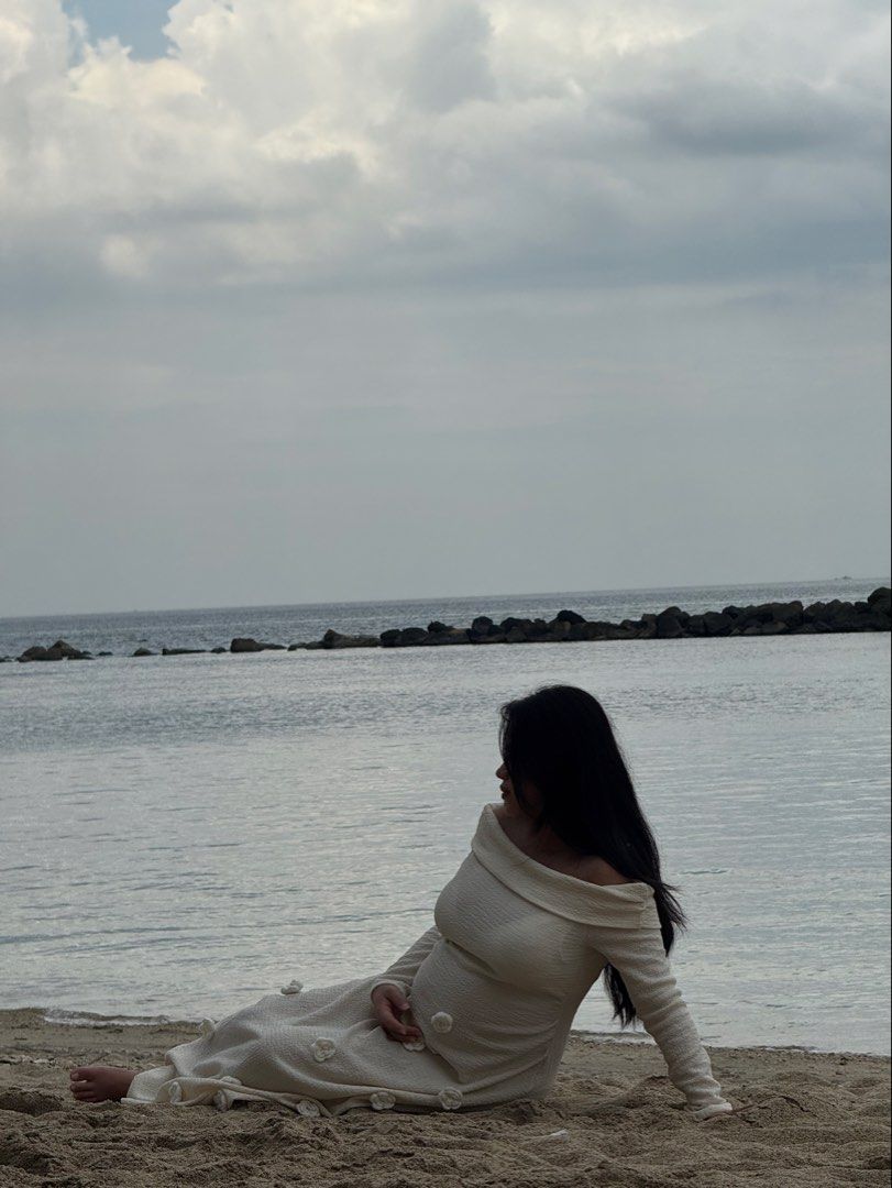 Off-shoulder maternity dress (Category: Dresses) located in Tagaytay City. Submitted by bohodreamer (Listing ID 1469407638, Image 1). Description: - Color: Cream - Style: Off-shoulder, full-length maternity dress with long sleeves - Material: Stretchy textured knit fabric that comfortably hugs the bump - Details: Cute 3D floral appliqués scattered down the front - Condition: Worn once for a beach photoshoot, freshly washed and ready for the next 