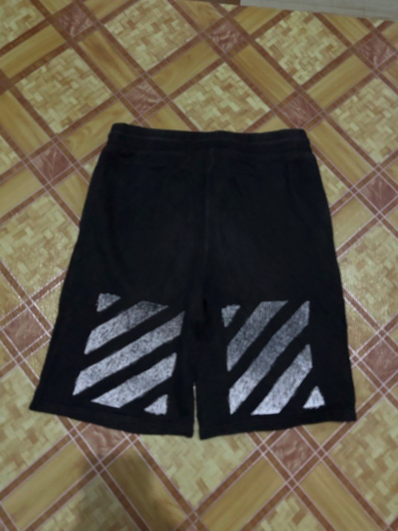 Off-White Black Sweatshorts with Diagonal Stripes (Category: Shorts) located in Manila. Submitted by garmentfinds.01 (Listing ID 1469523303, Image 2). Description: - Authentic Off-White black sweatshorts - Bold white printed branding across the front - Signature white diagonal stripe graphics on the back legs - Comfortable drawstring waistband with practical side pockets - Complete with official Off-White inner wash tags and branding labels - Con