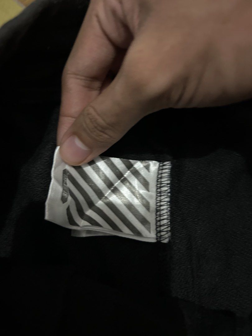 Off-White Black Sweatshorts with Diagonal Stripes (Category: Shorts) located in Manila. Submitted by garmentfinds.01 (Listing ID 1469523303, Image 3). Description: - Authentic Off-White black sweatshorts - Bold white printed branding across the front - Signature white diagonal stripe graphics on the back legs - Comfortable drawstring waistband with practical side pockets - Complete with official Off-White inner wash tags and branding labels - Con