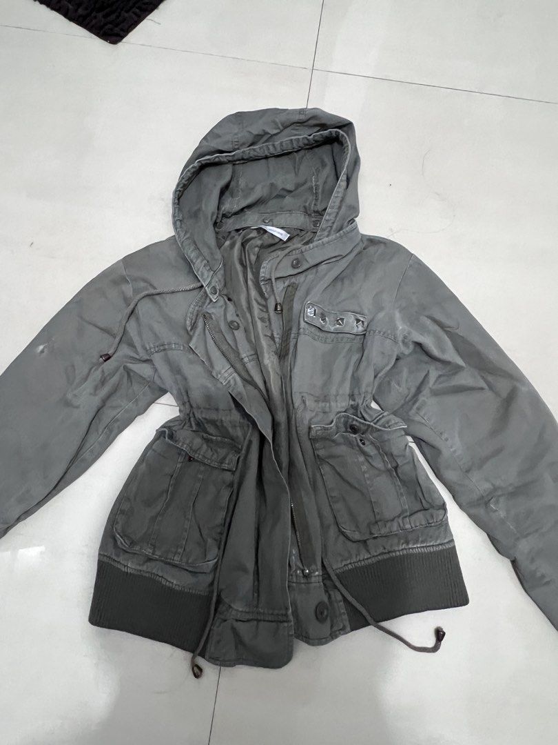 olive green studded cinchable hooded utility jacket (Category: Coats, Jackets and Outerwear) located in Caloocan City. Submitted by guaconerva97479 (Listing ID 1469556195, Image 1). Description: - Color: Olive green - Style: Casual utility jacket - Closure: Full front zipper with snap buttons - Hood: Built-in hood - Waist: Adjustable drawstring - Pockets: Two large front flap pockets and a chest pocket with stud detail - M-L - ramona flowers typa
