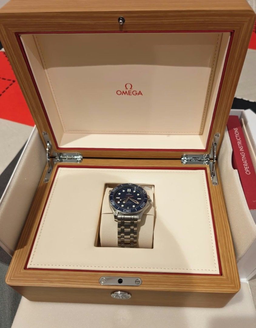 OMEGA Seamaster Diver 300M Blue Dial Watch (Category: Men's Watches) located in Manila. Submitted by reymondsa17617 (Listing ID 1469416265, Image 1). Description: - Brand/Model: OMEGA Seamaster Diver 300M - Movement: Automatic, keeps great time - Dial Color: Classic Blue - Material: Heavy-duty stainless steel bracelet and case - Inclusions: Original wooden presentation box and operating instructions - Condition: Brand New .