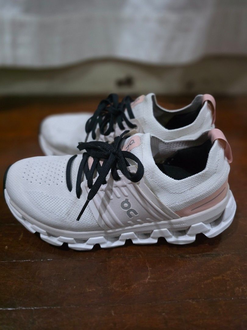 On Cloudswift Size US 7 (Category: Sneakers) located in Quezon City. Submitted by sec0nd.st0ry (Listing ID 1469503510, Image 3). Description: - Brand: On Cloud - Color: White and pink with black printed laces - Upper: Lightweight mesh with a breathable perforated toe box - Sole: Thick cushioned sole featuring signature cloud pods for ultimate comfort - Details: Signature On logo on the sides, tongue, and heel pull tab - Condition: Minor signs of 