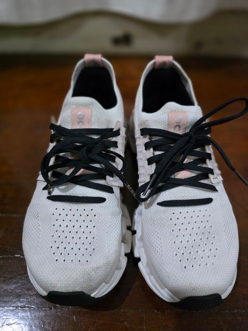On Cloudswift Size US 7 (Category: Sneakers) located in Quezon City. Submitted by sec0nd.st0ry (Listing ID 1469503510, Image 1). Description: - Brand: On Cloud - Color: White and pink with black printed laces - Upper: Lightweight mesh with a breathable perforated toe box - Sole: Thick cushioned sole featuring signature cloud pods for ultimate comfort - Details: Signature On logo on the sides, tongue, and heel pull tab - Condition: Minor signs of 