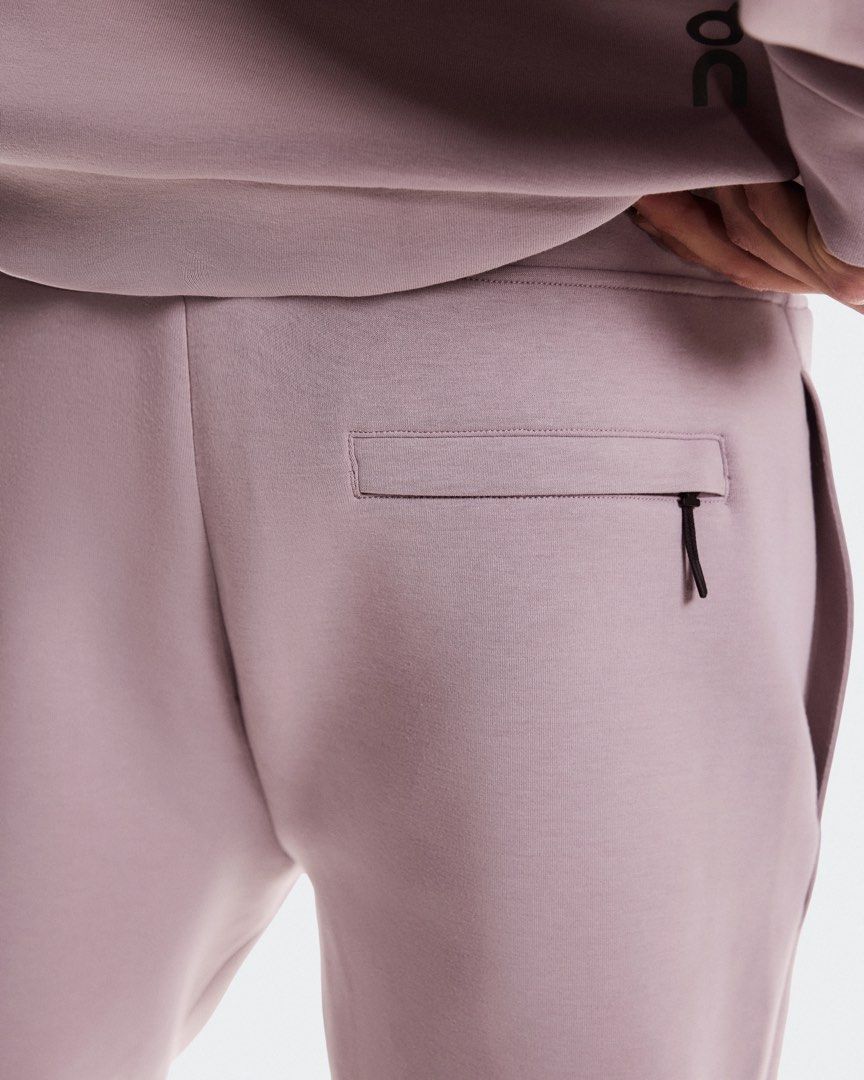 On Running Focus Sweatpants Heron (Category: Activewear) located in Manila. Submitted by pikkathchu (Listing ID 1469517894, Image 2). Description: - Brand: On Running - Color: Dusty Rose/Heron - Fit: Tapered fit with ribbed ankle cuffs - Pockets: Convenient zippered side pockets - Details: Clean stitching and branded pull tab - Condition: Soft and comfortable fabric construction.