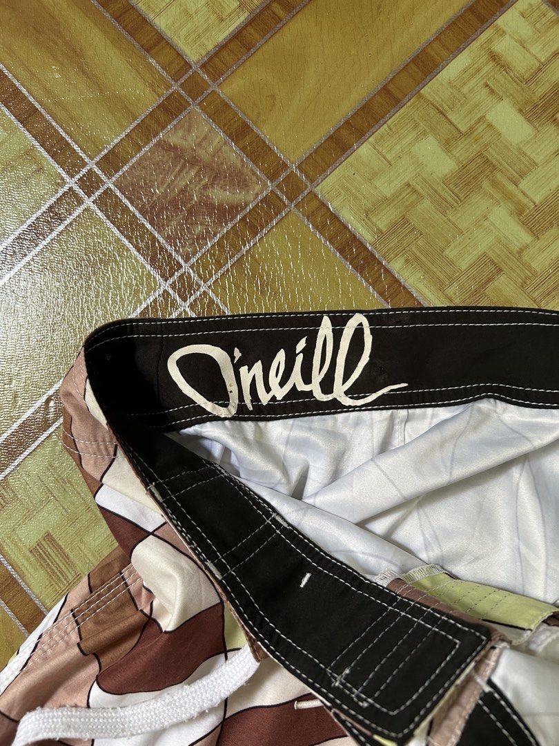 O'Neill Board Shorts Geometric Pattern Swim Trunks (Category: Swim Trunks & Board Shorts) located in Manila. Submitted by garmentfinds.01 (Listing ID 1469515395, Image 1). Description: - Brand: O'Neill - Design: Allover geometric swirl pattern in brown, cream, olive, and white - Closure: Secure drawstring waist with velcro fly - Storage: Convenient side cargo pocket on the left leg with embroidered O'Neill logo - Ideal for: Beach days, swimming, 