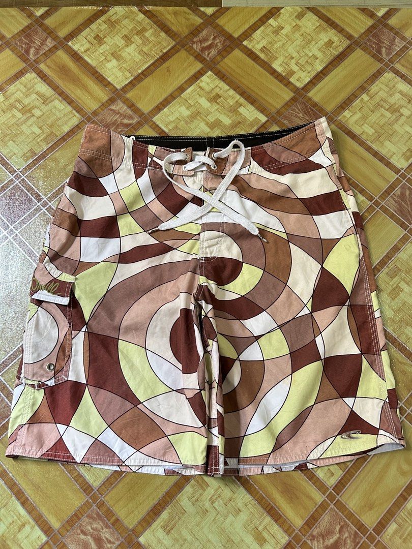 O'Neill Board Shorts Geometric Pattern Swim Trunks (Category: Swim Trunks & Board Shorts) located in Manila. Submitted by garmentfinds.01 (Listing ID 1469515395, Image 2). Description: - Brand: O'Neill - Design: Allover geometric swirl pattern in brown, cream, olive, and white - Closure: Secure drawstring waist with velcro fly - Storage: Convenient side cargo pocket on the left leg with embroidered O'Neill logo - Ideal for: Beach days, swimming, 