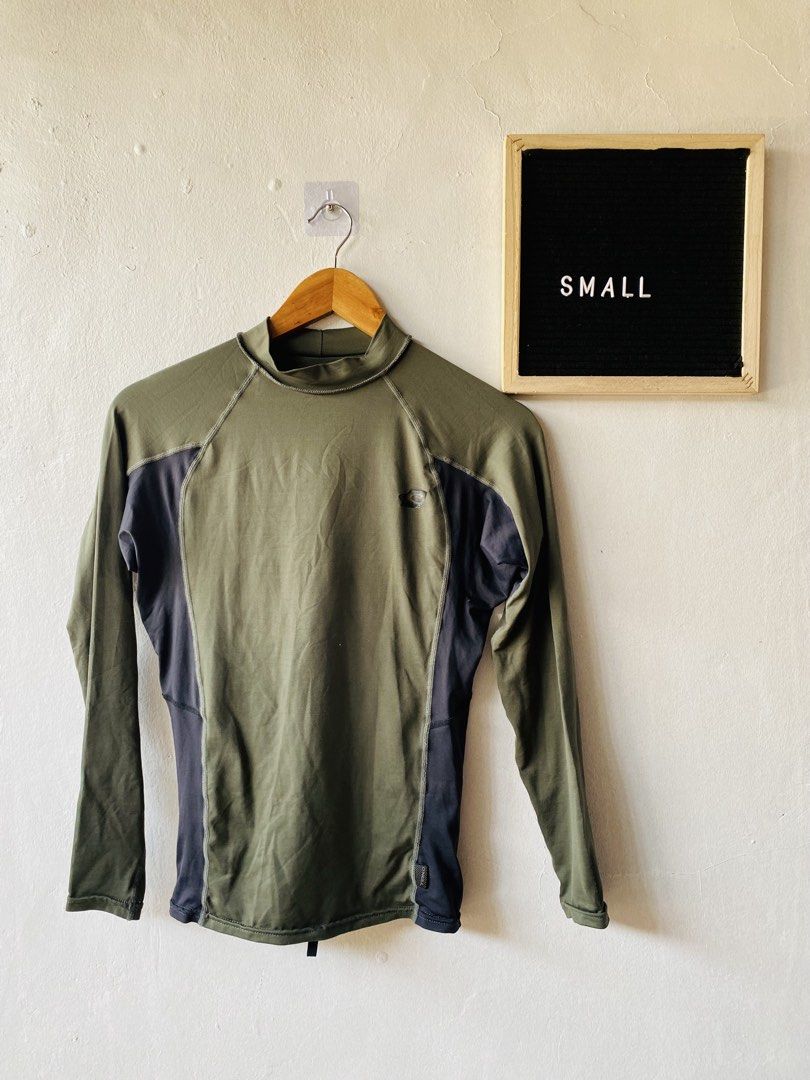 O'Neill Performance Fit Rash Guard (Category: Activewear) located in Caloocan City. Submitted by lovemyclothes21 (Listing ID 1469407488, Image 1). Description: - Brand: O'Neill - Type: Long Sleeve Performance Fit Rash Guard - Color: Green and Dark Grey with contrast side panels and neck collar - Size: Small (UK-S / EU-48) - Material: 91% nylon, 9% spandex - Features: Great stretch, lightweight - Ideal for: Surfing, swimming, and water sports.