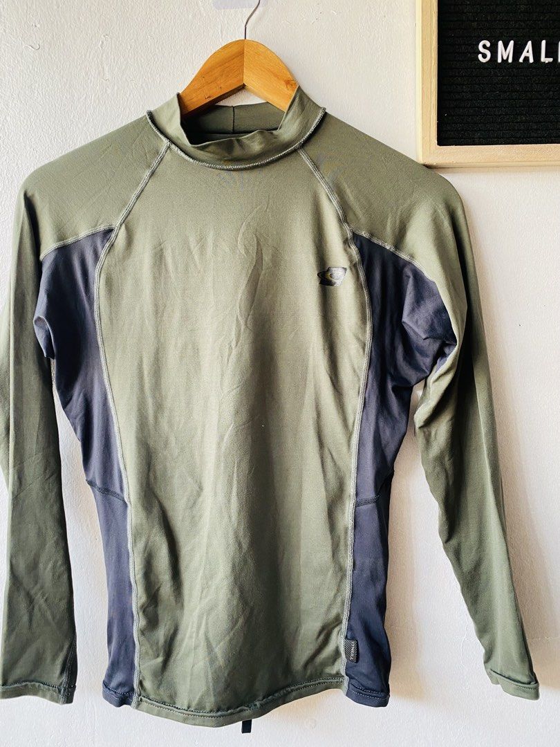 O'Neill Performance Fit Rash Guard (Category: Activewear) located in Caloocan City. Submitted by lovemyclothes21 (Listing ID 1469407488, Image 2). Description: - Brand: O'Neill - Type: Long Sleeve Performance Fit Rash Guard - Color: Green and Dark Grey with contrast side panels and neck collar - Size: Small (UK-S / EU-48) - Material: 91% nylon, 9% spandex - Features: Great stretch, lightweight - Ideal for: Surfing, swimming, and water sports.