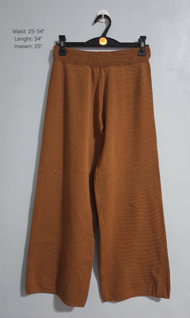 Orange Knit Wide Leg Pants (Category: Jeans) located in Paranaque City. Submitted by franinnashop (Listing ID 1469458868, Image 1). Description: Declutter - Color: Rich orange - Style: Knit wide-leg pants - Waistband: Elastic ribbed waistband for a comfortable stretch - Best for: Lounging, casual wear, and running errands - Waist: 25-34 inches - Length: 34 inches - Inseam: 25 inches - Condition: Excellent.