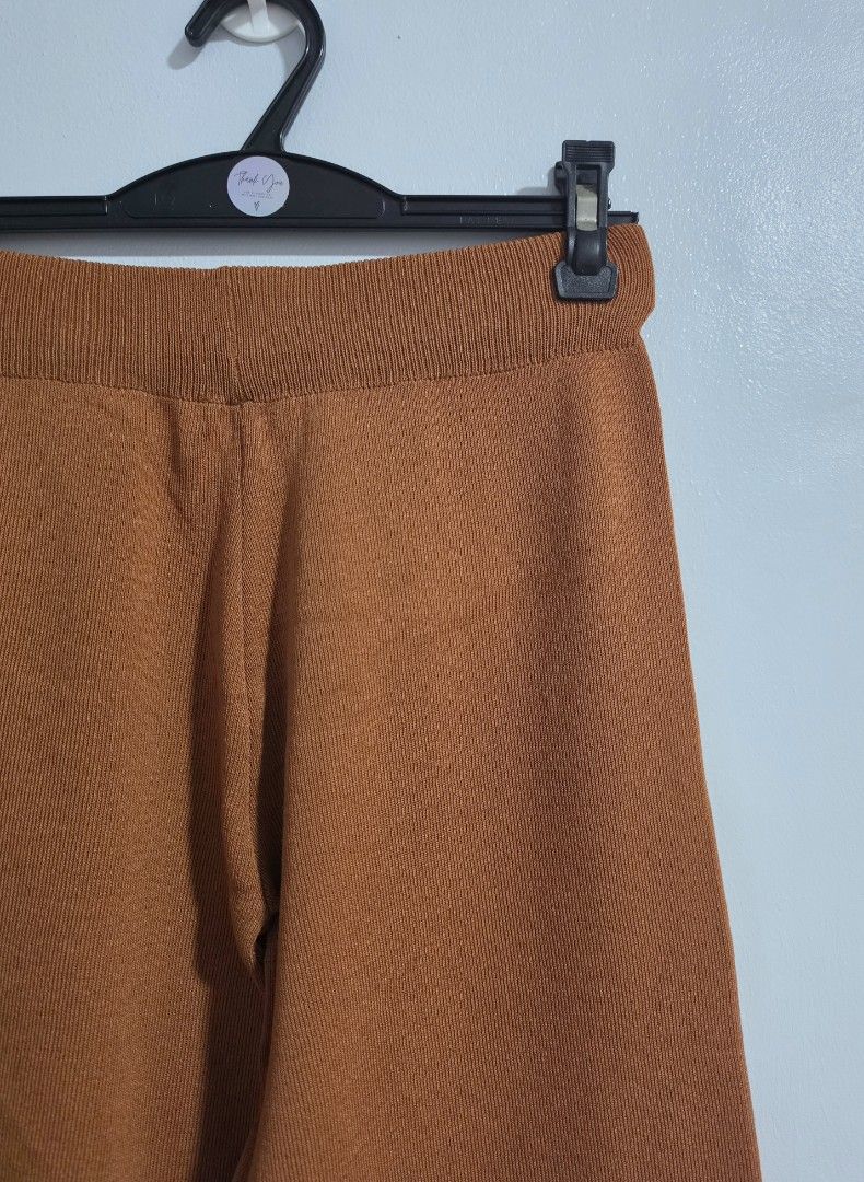 Orange Knit Wide Leg Pants (Category: Jeans) located in Paranaque City. Submitted by franinnashop (Listing ID 1469458868, Image 2). Description: Declutter - Color: Rich orange - Style: Knit wide-leg pants - Waistband: Elastic ribbed waistband for a comfortable stretch - Best for: Lounging, casual wear, and running errands - Waist: 25-34 inches - Length: 34 inches - Inseam: 25 inches - Condition: Excellent.