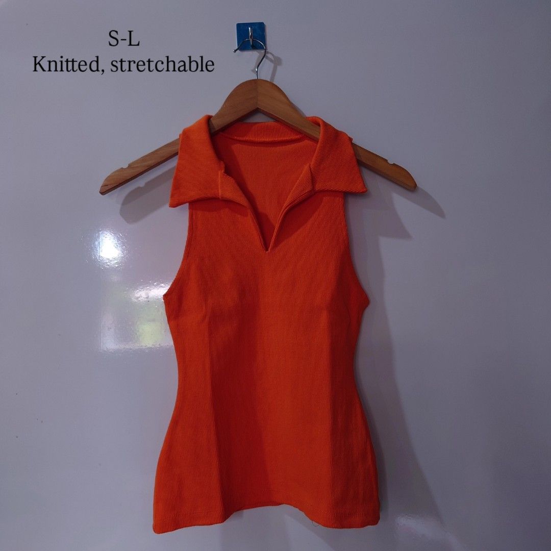 Orange Knitted Stretchable Collared Sleeveless Top (Category: Sleeveless) located in Diffun. Submitted by declutteredbyJill (Listing ID 1469571006, Image 1). Description: - Color: Bright orange - Design: Collar, V-neck cutout, and sleeveless - Texture: Ribbed knit, highly stretchy material that hugs the body comfortably - Size: Fits S to L easily - Styling: Great for standing out; easy to pair with high-waisted jeans or skirts.