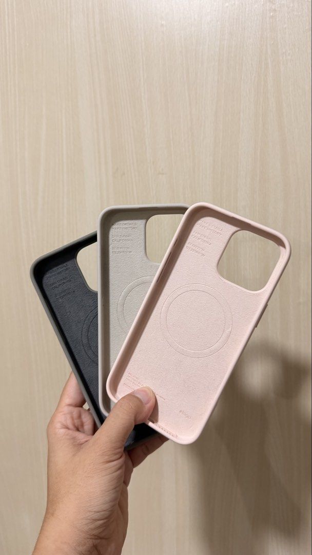 Orig Elago phone case 16 Pro Max (Category: Cases & Sleeves) located in Manila. Submitted by marixia (Listing ID 1469534250, Image 2). Description: - Brand: Original Elago - Compatibility: iPhone 16 Pro Max - Material: Premium smooth silicone with soft inner lining - Features: MagSafe compatible ring design, camera cutout protection - Condition: Excellent, like new (Layer 4) - Colors: Pastel Pink, Light Gray, Dark Green.