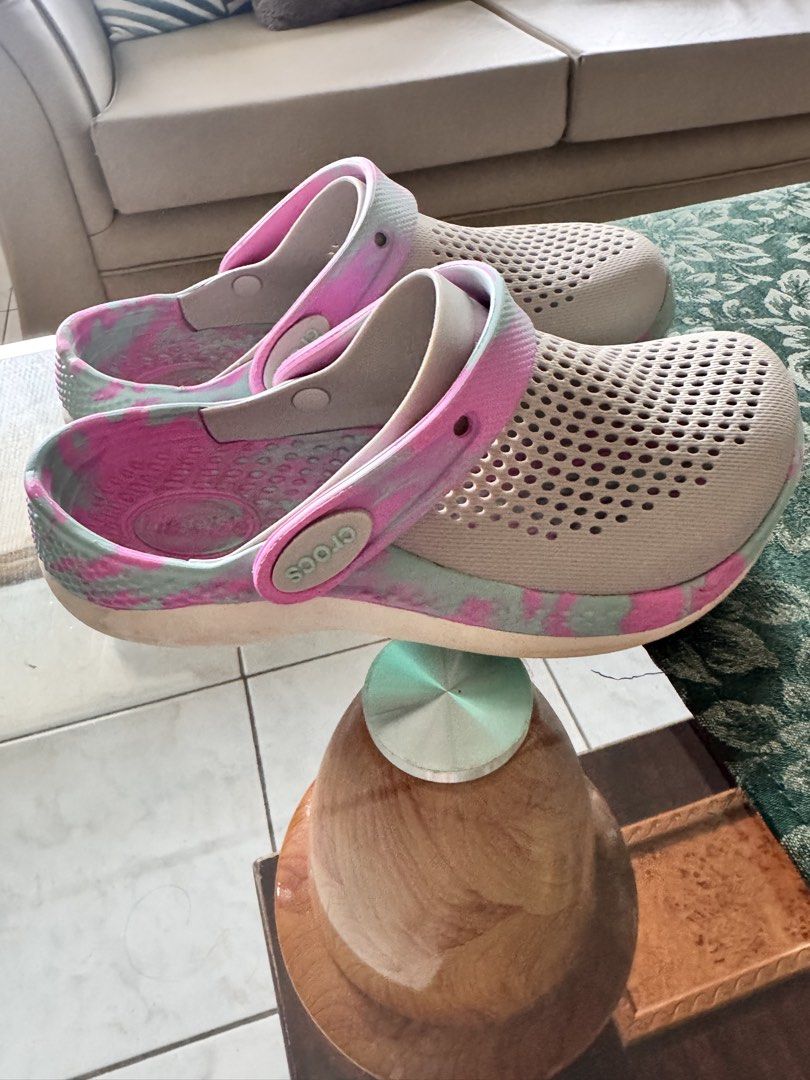 Original Crocs LiteRide Clogs Tie Dye Pink Blue Size J2 (Category: Slippers and slides) located in Batangas. Submitted by ayeeftz (Listing ID 1469421863, Image 3). Description: - Brand: Crocs - Model: LiteRide Clogs - Color: Grey with pink and blue tie-dye straps - Features: Breathable perforated uppers, super comfortable foam footbeds, and pivoting heel straps with embossed logo - Sizing: Exact measured length shown with tape in the photos - Per