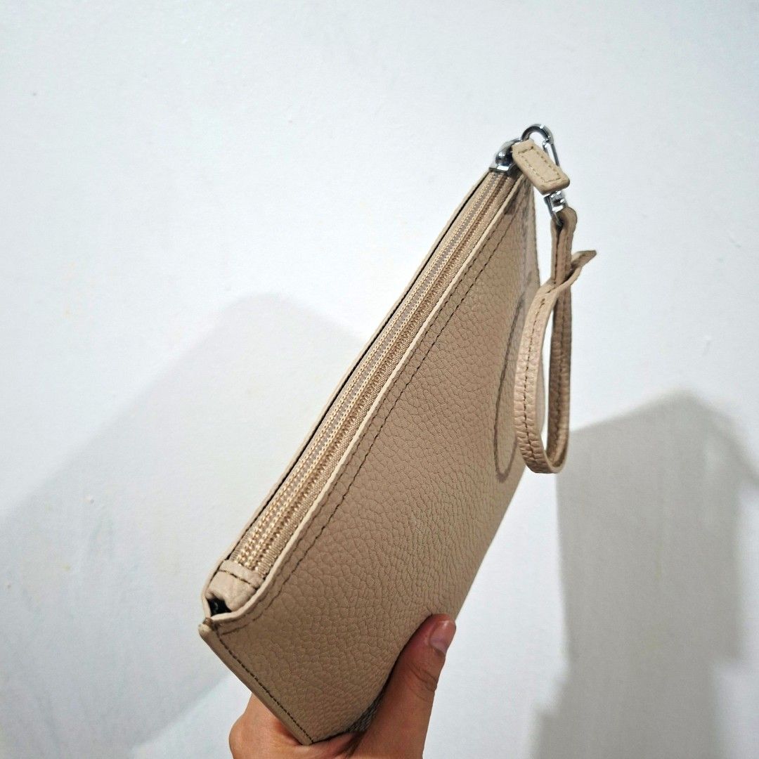 Original LACOSTE Genuine Leather Mini Pouch (Category: Clutches) located in Cagayan de Oro. Submitted by langscloset (Listing ID 1469489584, Image 3). Description: like new, no issue at all. original lacoste. this pouch is from my Lacoste tote bag, used once only. .
