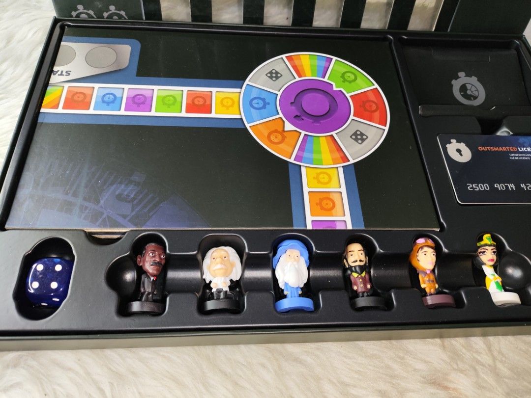 Outsmarted! The Live Quiz Show Board Game (Category: Board Games & Puzzles) located in Cavite. Submitted by tinetaclesss (Listing ID 1469507049, Image 3). Description: - Game: Outsmarted! Live quiz show board game - Inclusion: Complete set with board, 6 character figurines, dice, license key card, stand, and instruction manual - Features: App integration available on App Store and Google Play for smartphones and tablets - Condition: Box packaging