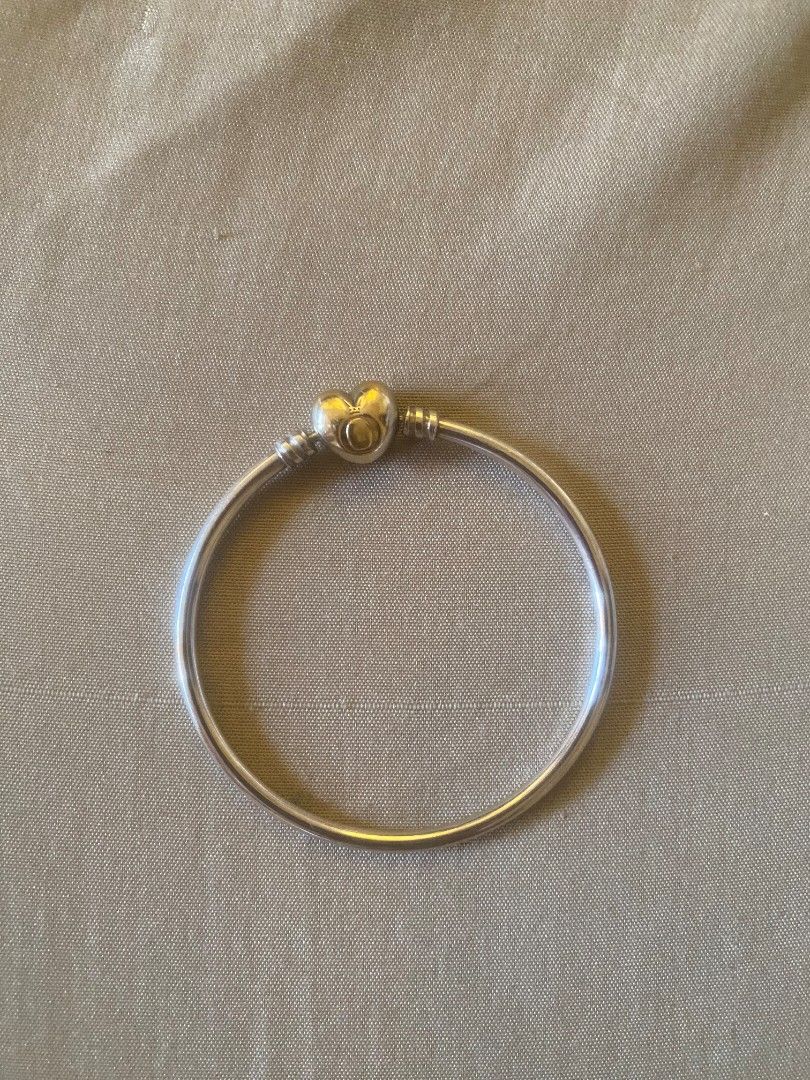 Pandora Silver Bangle with Heart Clasp (Category: Bracelets) located in Muntinlupa City. Submitted by swiftowl.0cc8ab (Listing ID 1469451366, Image 2). Description: - 100% Authentic Pandora silver bangle bracelet - Features a secure heart-shaped clasp closure with fine engraved details - Sturdy metal construction with a clean, polished finish - Includes original white Pandora gift box, original price: 7699 - Perfect as a standalone piece or stack