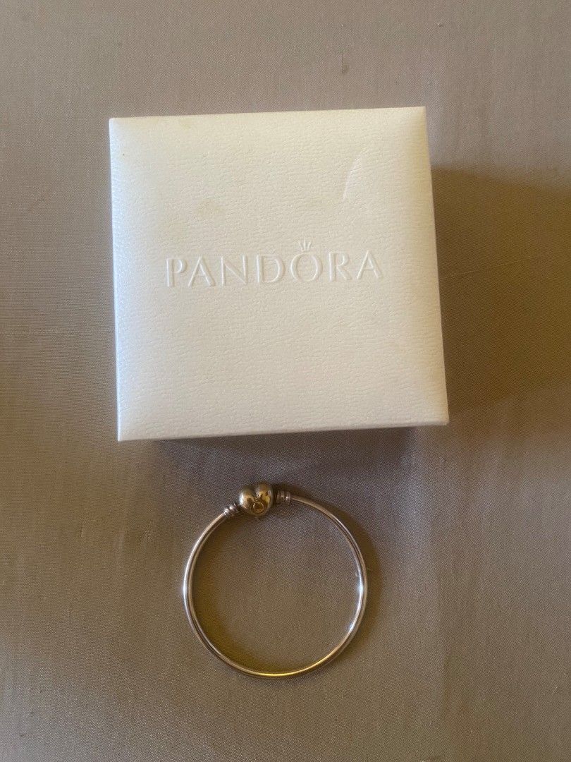 Pandora Silver Bangle with Heart Clasp (Category: Bracelets) located in Muntinlupa City. Submitted by swiftowl.0cc8ab (Listing ID 1469451366, Image 1). Description: - 100% Authentic Pandora silver bangle bracelet - Features a secure heart-shaped clasp closure with fine engraved details - Sturdy metal construction with a clean, polished finish - Includes original white Pandora gift box, original price: 7699 - Perfect as a standalone piece or stack