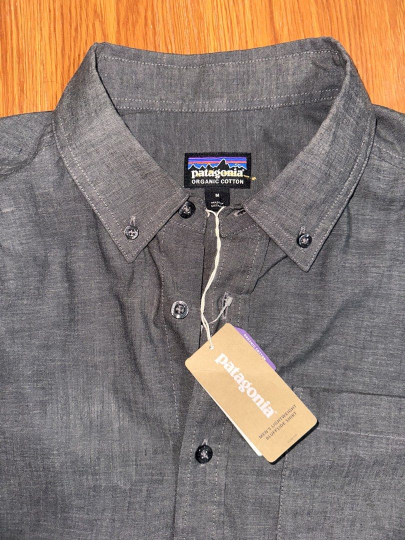 Patagonia Men’s Lightweight Bluffside Shirt (Category: Tshirts & Polo Shirts ) located in Makati City. Submitted by JohnnyT20 (Listing ID 1469512976, Image 1). Description: - Brand: Patagonia - Item: Men's Lightweight Bluffside Shirt - Color: Dark Grey - Size: Men's Medium (Slim Fit) - Material: Organic cotton - Features: Short sleeves, button-down collar, single chest pocket - Condition: Brand new with tags attached Direct message for inquiries 