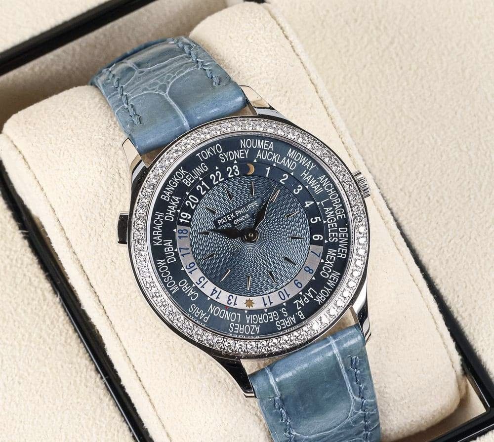 Patek Philippe World Time 7130G-016 (Category: Watches) located in Singapore. Submitted by deuhandy (Listing ID 1469468345, Image 1). Description: - Brand/Model: Patek Philippe World Time Ref. 7130G-016 - Case: 18k White Gold set with 89 diamonds (1.092 ct) - Dial: Blue guilloche with world timer and 24-hour day/night indicator - Strap: blue alligator leather strap - Includes: Original presentation box, tags, leather folder, and complete paperwor
