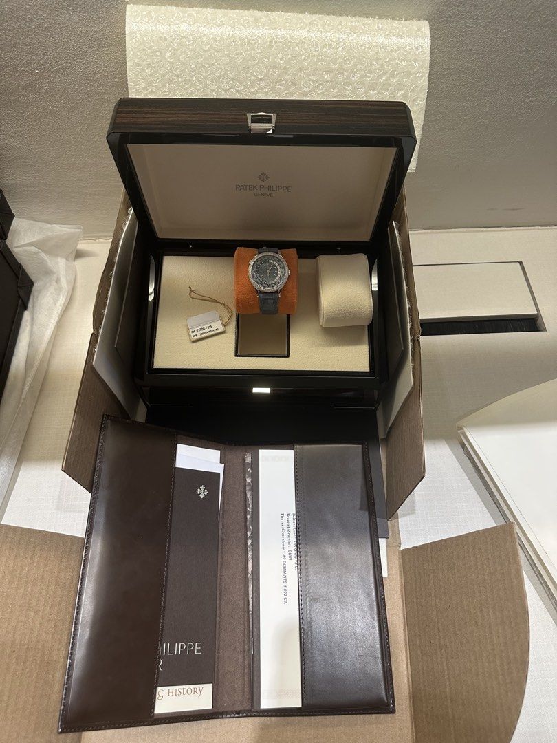 Patek Philippe World Time 7130G-016 (Category: Watches) located in Singapore. Submitted by deuhandy (Listing ID 1469468345, Image 3). Description: - Brand/Model: Patek Philippe World Time Ref. 7130G-016 - Case: 18k White Gold set with 89 diamonds (1.092 ct) - Dial: Blue guilloche with world timer and 24-hour day/night indicator - Strap: blue alligator leather strap - Includes: Original presentation box, tags, leather folder, and complete paperwor