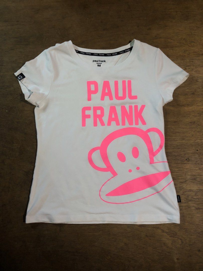 Paul Frank (Category: Activewear) located in Davao. Submitted by blufinds (Listing ID 1469463002, Image 1). Description: This is a Paul Frank white women’s graphic t-shirt featuring bold neon pink lettering of the brand name and the iconic Julius the Monkey face graphic..