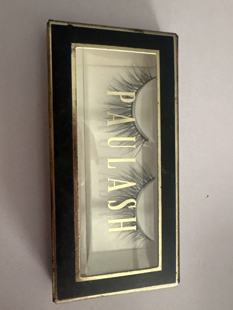 Paulash False Eyelashes (Category: Makeup) located in Manila. Submitted by yuribeepbop (Listing ID 1469471406, Image 1). Description: - Brand: Paulash - Item: False eyelashes (wispy style) - Condition: Unused item inside, box has minor edge wear from storage - Packaging: Black and gold rectangular box with a clear display window - RFS: Decluttering / Extra stock.