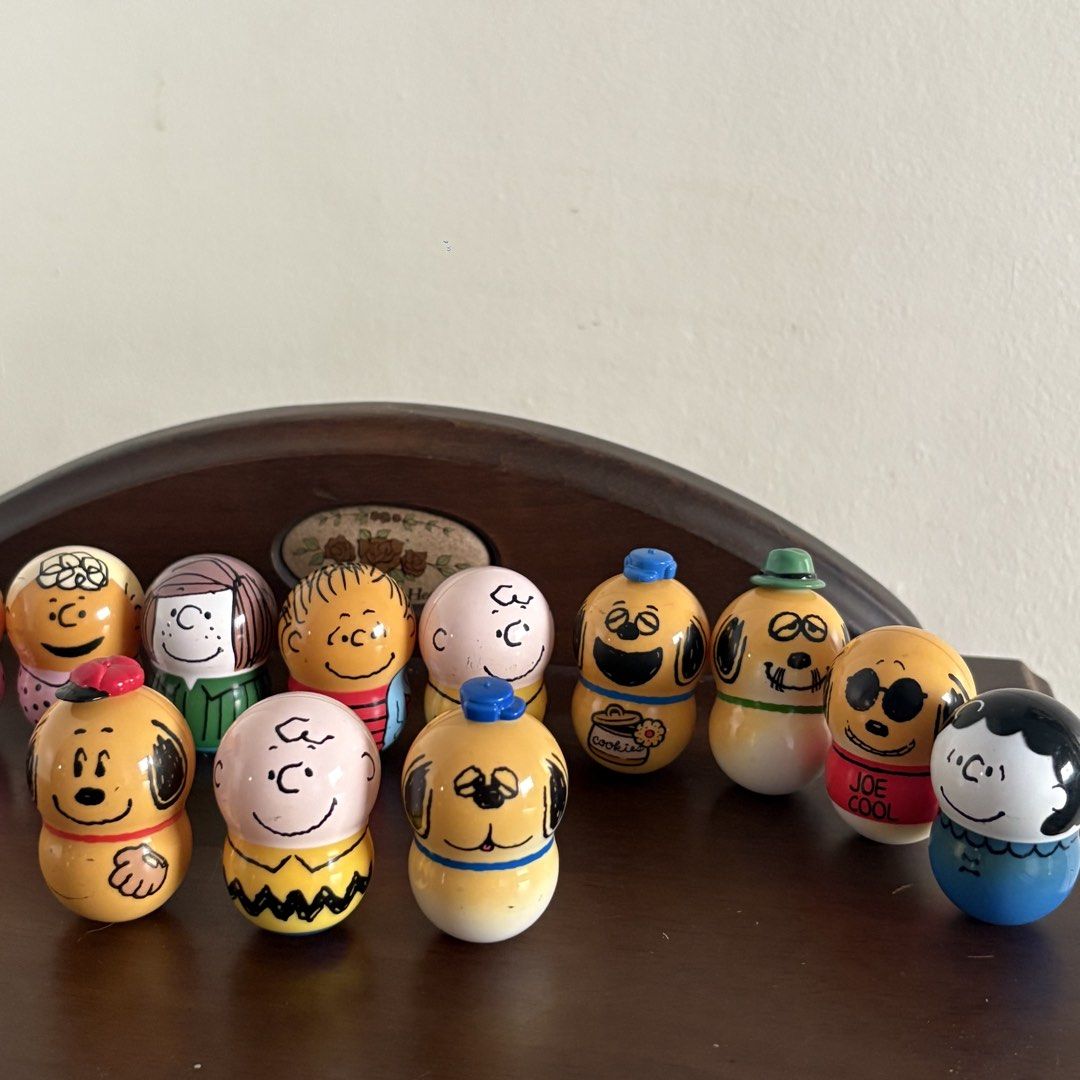 Peanuts Snoopy and Friends Balancer Figure SET (Category: Figurines & Statues) located in Manila. Submitted by aobacafe (Listing ID 1469454210, Image 3). Description: - Set of 12 hand-painted Peanuts miniature wooden peg dolls - Includes Charlie Brown, Snoopy in various outfits, Woodstock, Lucy, and friends - Features classic comic strip style and detailed craftsmanship - Great collectible items for Peanuts fans and home shelf display.