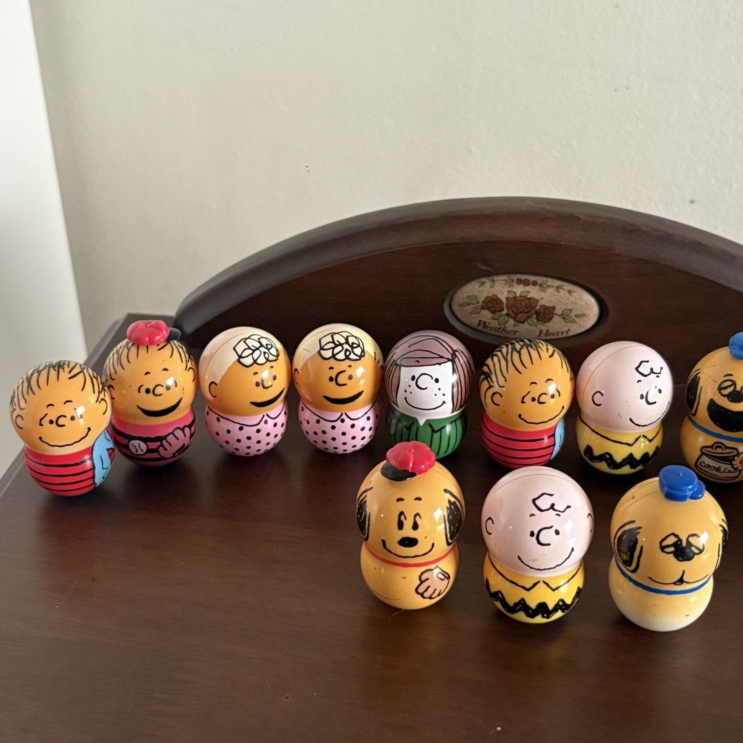 Peanuts Snoopy and Friends Balancer Figure SET (Category: Figurines & Statues) located in Manila. Submitted by aobacafe (Listing ID 1469454210, Image 2). Description: - Set of 12 hand-painted Peanuts miniature wooden peg dolls - Includes Charlie Brown, Snoopy in various outfits, Woodstock, Lucy, and friends - Features classic comic strip style and detailed craftsmanship - Great collectible items for Peanuts fans and home shelf display.