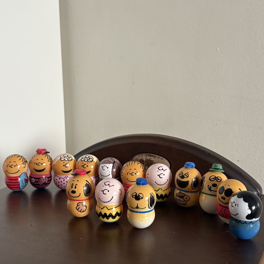 Peanuts Snoopy and Friends Balancer Figure SET (Category: Figurines & Statues) located in Manila. Submitted by aobacafe (Listing ID 1469454210, Image 1). Description: - Set of 12 hand-painted Peanuts miniature wooden peg dolls - Includes Charlie Brown, Snoopy in various outfits, Woodstock, Lucy, and friends - Features classic comic strip style and detailed craftsmanship - Great collectible items for Peanuts fans and home shelf display.